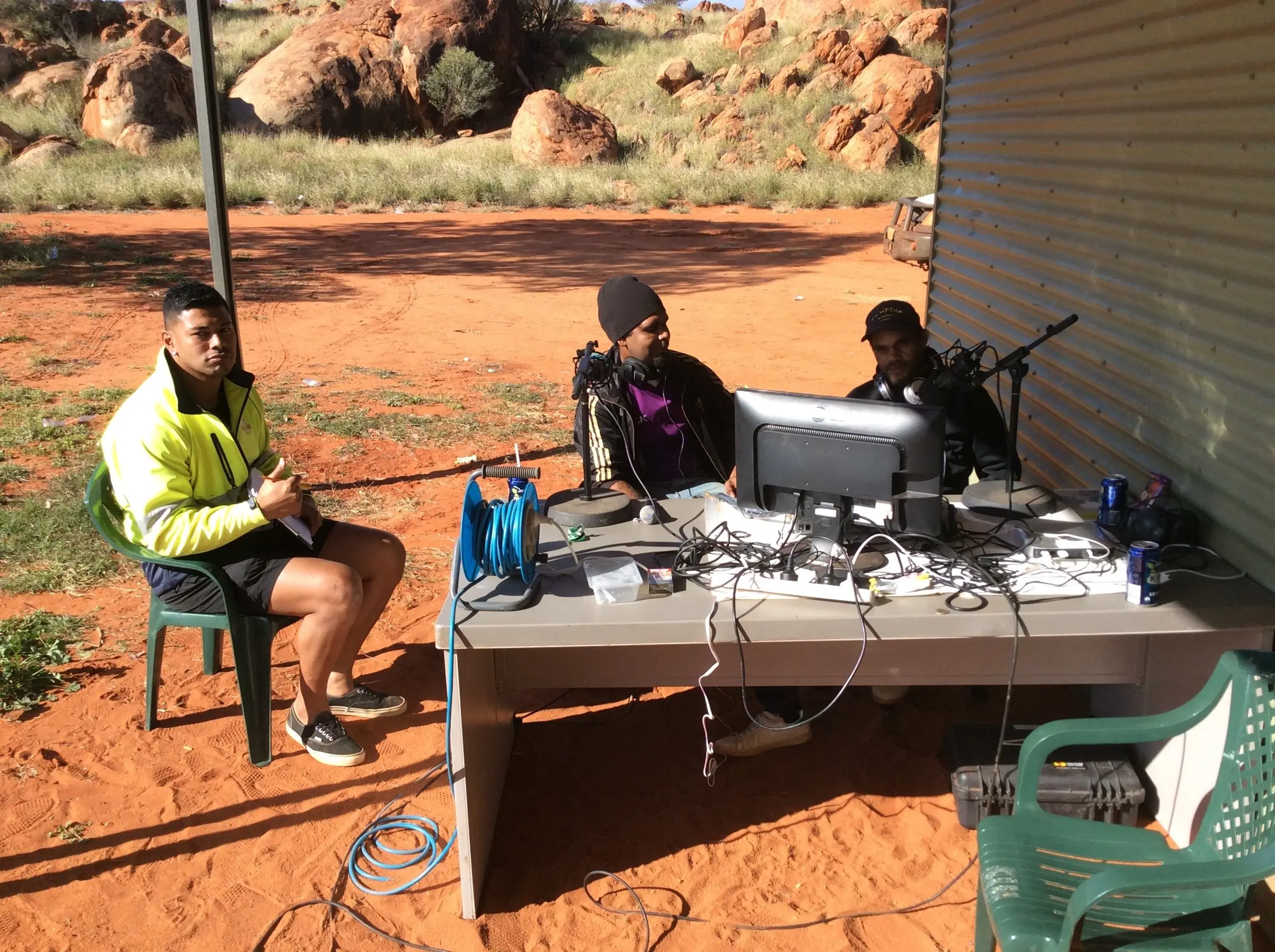Outside broadcast crew on red earth